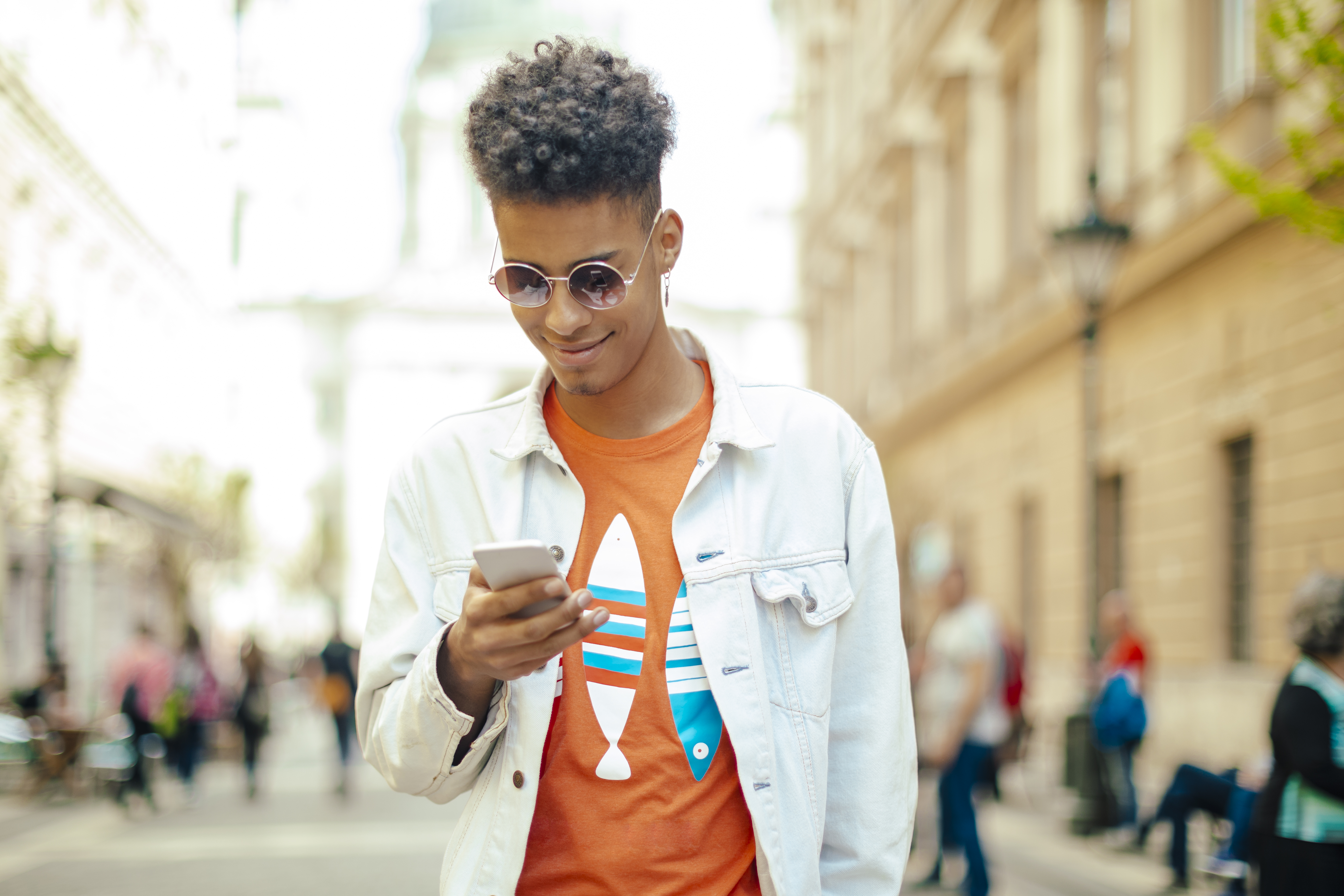 Young man using phone in the city
