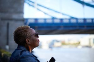 A black woman in holiday by her self in London