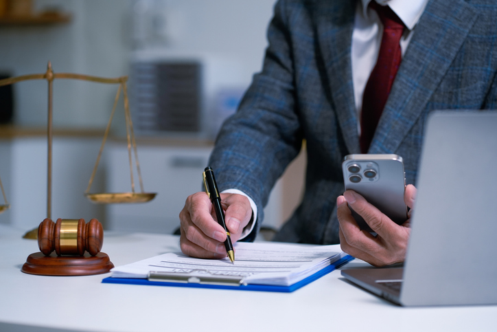 Lawyer singing in documents, filling court records, job responsibilities in office.