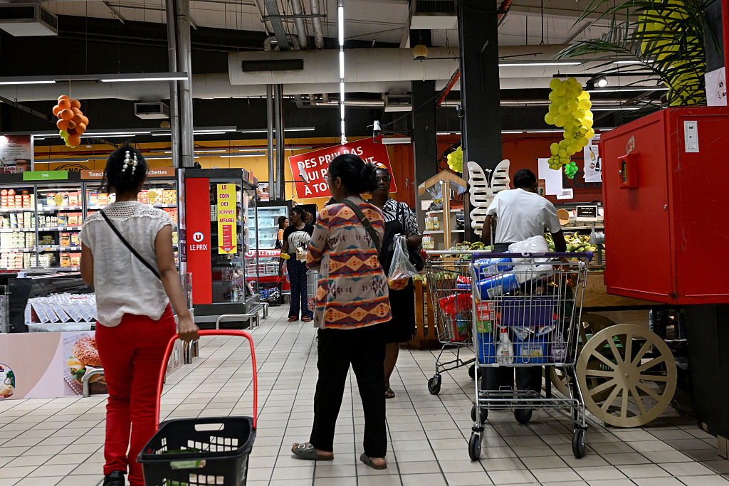 POLITICS-ICOAST-ECONOMY-FEATURE